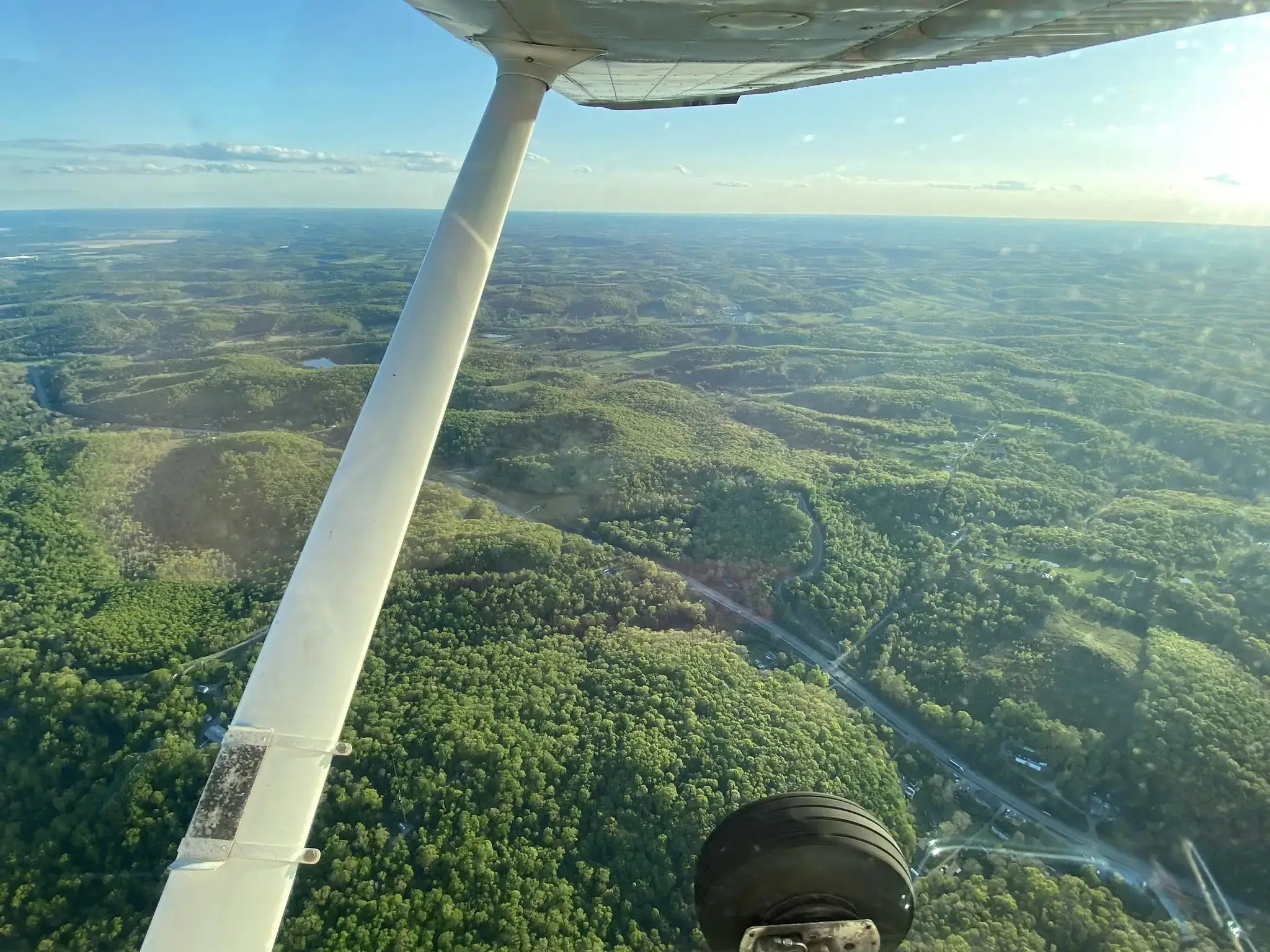 Landscape seen from the right window of a Dayton Aviation Services aircraft