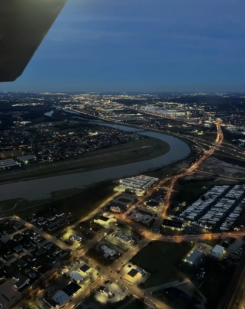 Night flight over city seen from cockpit window