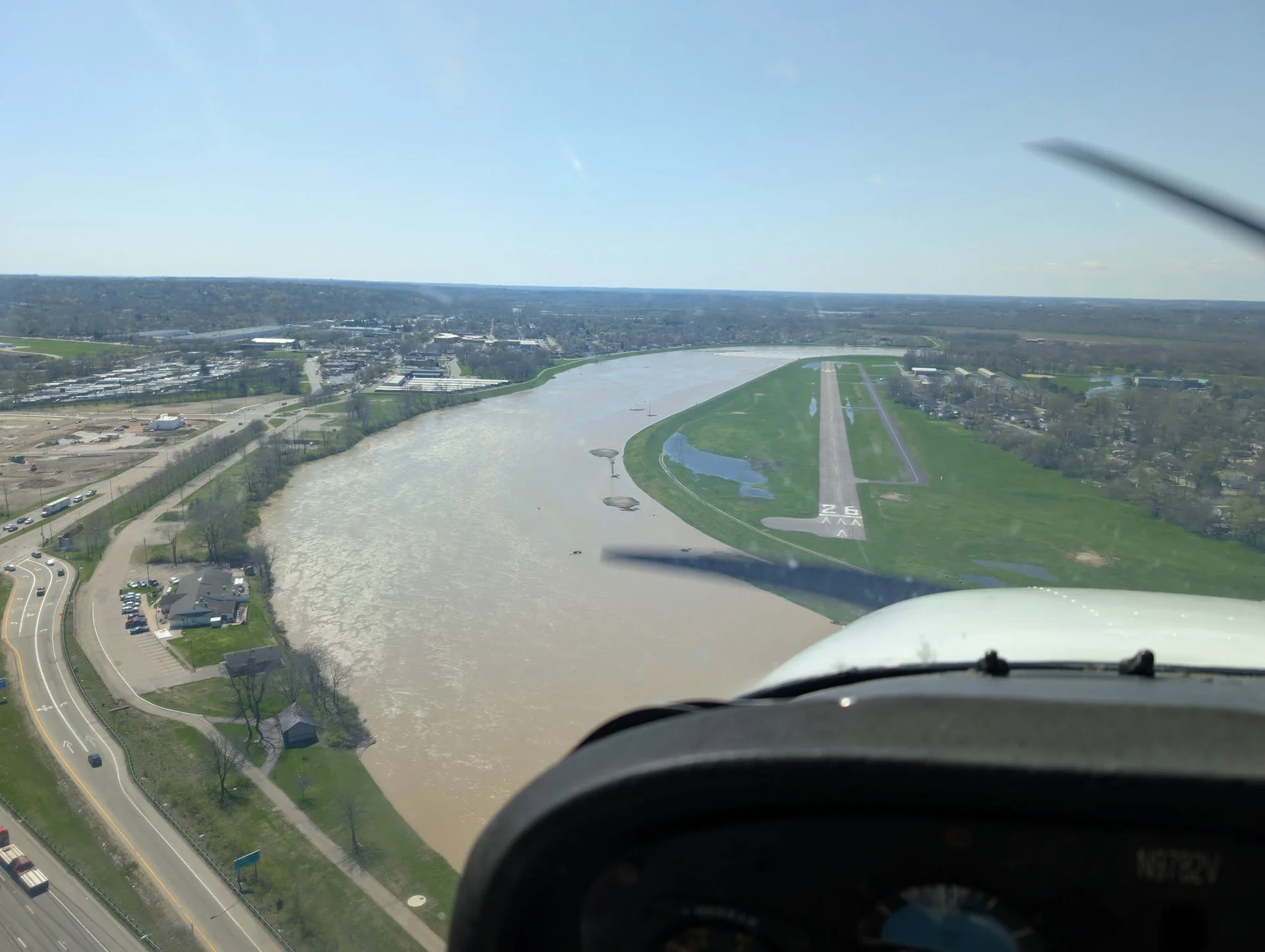 Cockpit view approaching a riverside runway during flight training in Ohio